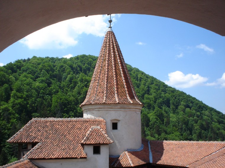 A round tower and tiled roofs in Bran Castle, Transylvania.