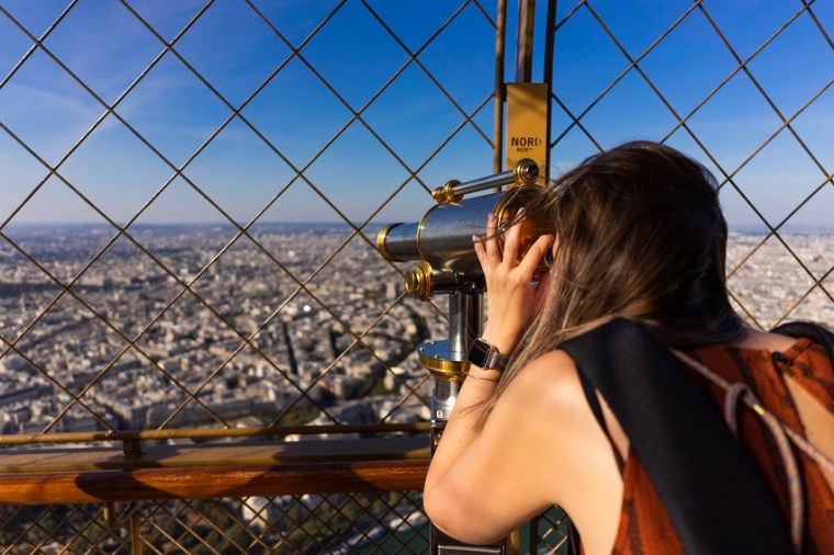 inside the eiffel tower, using the telescope for amazing paris views
