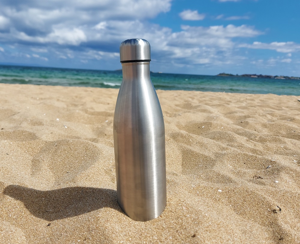Bringing a reusable water bottle at the beach is always a good idea.